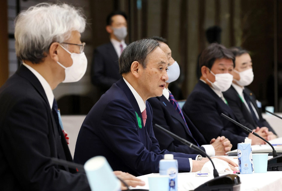 写真)第2回気候変動対策推進のための有識者会議で発言する菅総理大臣。2021年4月19日